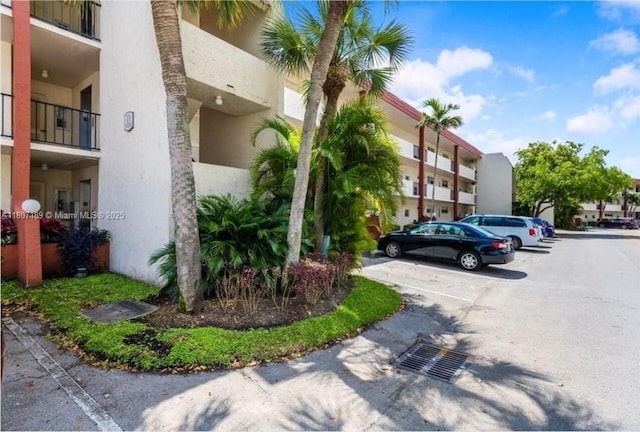 9220 S Hollybrook Lake Dr Unit 208, Pembroke Pines, FL 33025 - view of apartment building / complex featuring uncovered parking