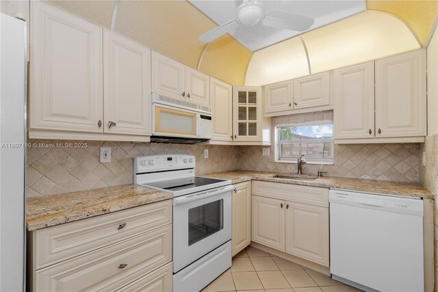 9220 S Hollybrook Lake Dr Unit 208, Pembroke Pines, FL 33025 - kitchen with white appliances, a sink, a ceiling fan, decorative backsplash, and light tile patterned floors