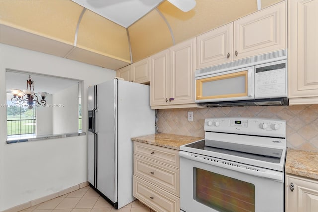 9220 S Hollybrook Lake Dr Unit 208, Pembroke Pines, FL 33025 - kitchen featuring white appliances, decorative backsplash, a chandelier, light stone countertops, and light tile patterned floors
