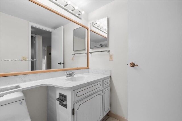 9220 S Hollybrook Lake Dr Unit 208, Pembroke Pines, FL 33025 - half bathroom with vanity, toilet, and tile patterned floors