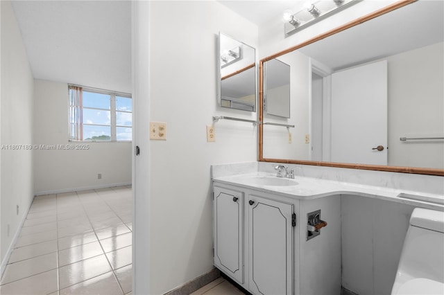 9220 S Hollybrook Lake Dr Unit 208, Pembroke Pines, FL 33025 - half bathroom featuring baseboards, vanity, toilet, and tile patterned flooring