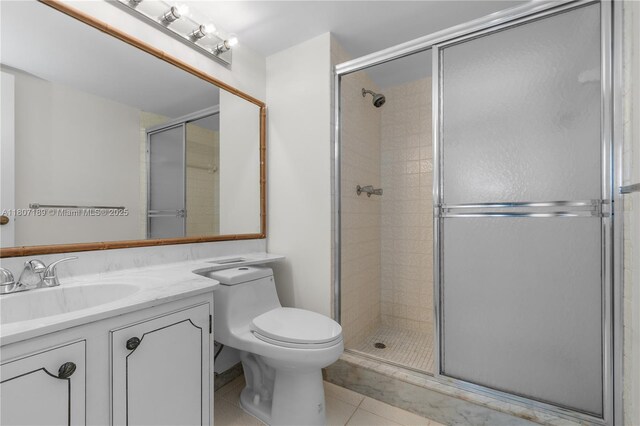 9220 S Hollybrook Lake Dr Unit 208, Pembroke Pines, FL 33025 - bathroom with a shower stall, vanity, toilet, and tile patterned floors