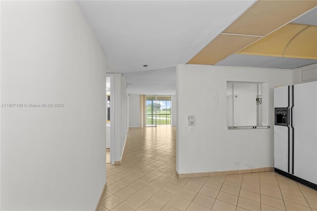 9220 S Hollybrook Lake Dr Unit 208, Pembroke Pines, FL 33025 - hall featuring light tile patterned floors and baseboards