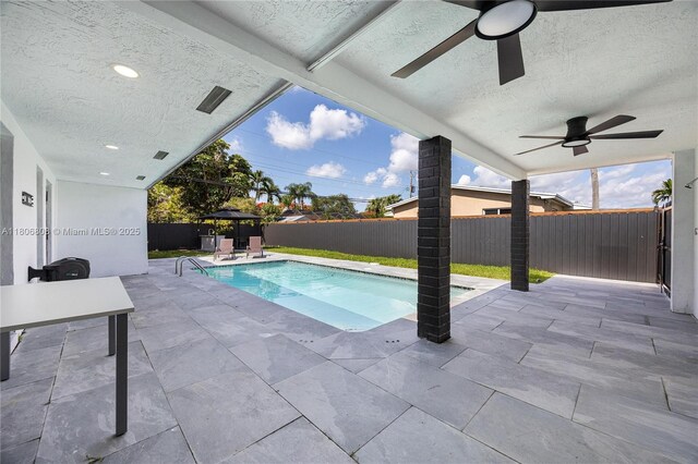 9240 SW 57th Ter, Miami, FL 33173 - view of swimming pool with ceiling fan, a patio area, and a fenced backyard