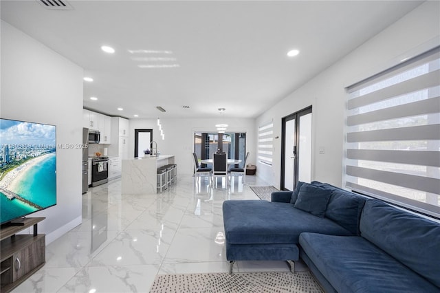 9240 SW 57th Ter, Miami, FL 33173 - living room with recessed lighting, light marble finish flooring, baseboards, and french doors