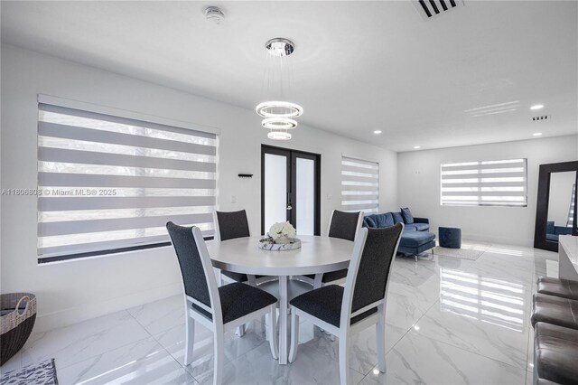 9240 SW 57th Ter, Miami, FL 33173 - dining room featuring french doors, marble look tile flooring, recessed lighting, and a chandelier
