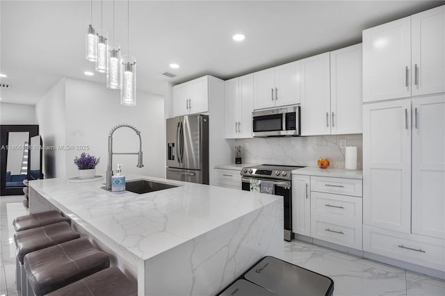 9240 SW 57th Ter, Miami, FL 33173 - kitchen featuring stainless steel appliances, a sink, recessed lighting, white cabinetry, and tasteful backsplash