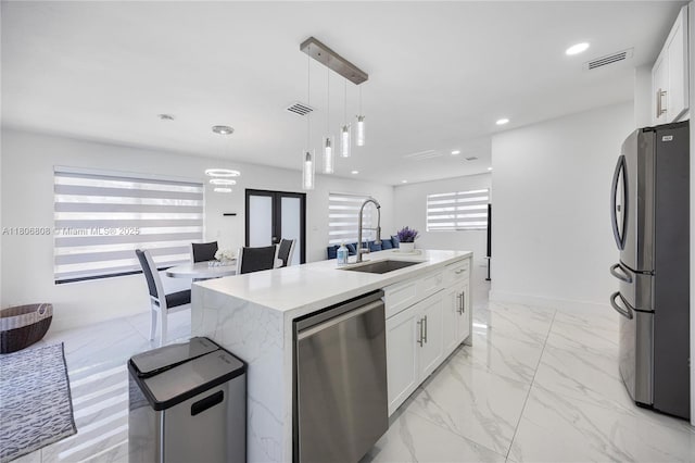 9240 SW 57th Ter, Miami, FL 33173 - kitchen featuring stainless steel appliances, a sink, white cabinets, pendant lighting, and recessed lighting