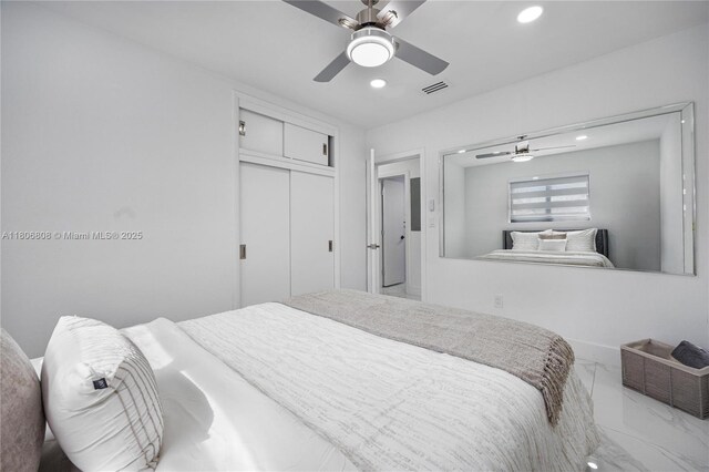 9240 SW 57th Ter, Miami, FL 33173 - bedroom with marble look tile flooring, recessed lighting, a closet, and ceiling fan