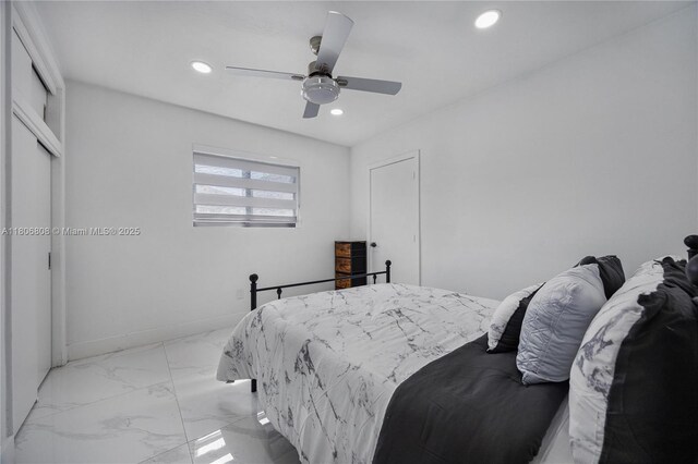 9240 SW 57th Ter, Miami, FL 33173 - bedroom featuring light marble finish floors, recessed lighting, a ceiling fan, baseboards, and a closet