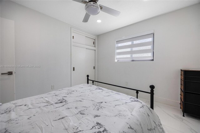 9240 SW 57th Ter, Miami, FL 33173 - bedroom featuring recessed lighting, a closet, light marble finish flooring, ceiling fan, and baseboards