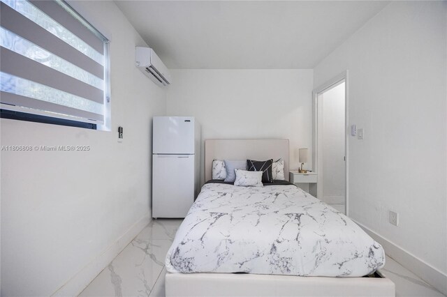 9240 SW 57th Ter, Miami, FL 33173 - bedroom featuring freestanding refrigerator, an AC wall unit, light marble finish flooring, and baseboards