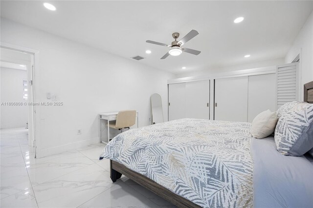 9240 SW 57th Ter, Miami, FL 33173 - bedroom with recessed lighting, two closets, light marble finish floors, a ceiling fan, and baseboards