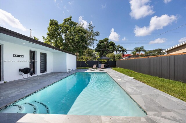 9240 SW 57th Ter, Miami, FL 33173 - view of pool with a gazebo, a fenced backyard, and a patio