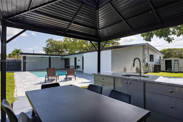 9240 SW 57th Ter, Miami, FL 33173 - view of patio / terrace featuring a sink and outdoor dining area