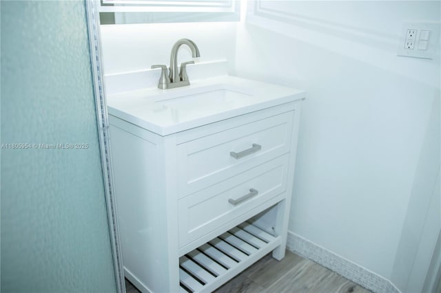 5141 W Oakland Park Blvd Unit 210, Lauderdale Lakes, FL 33313 - bathroom featuring vanity and wood finished floors