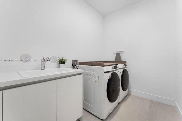16703 S Botaniko Dr S, Weston, FL 33326 - laundry area featuring washer and clothes dryer, baseboards, and light tile patterned flooring