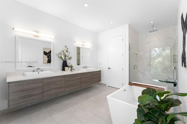 16703 S Botaniko Dr S, Weston, FL 33326 - full bathroom featuring a marble finish shower, double vanity, a freestanding tub, tile patterned flooring, and recessed lighting