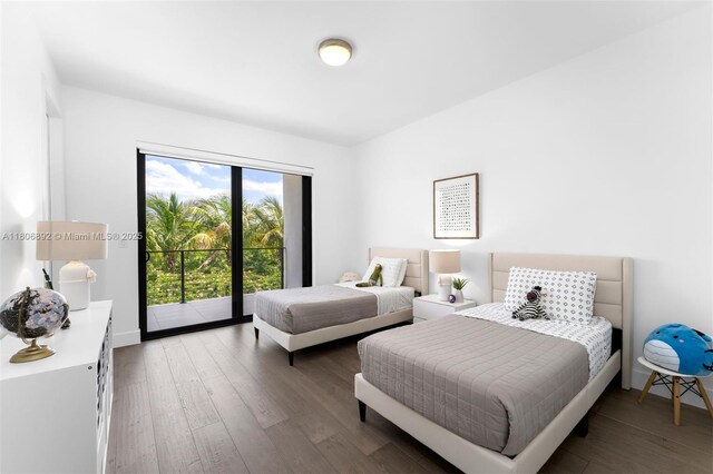 16703 S Botaniko Dr S, Weston, FL 33326 - bedroom with wood finished floors, access to outside, and baseboards