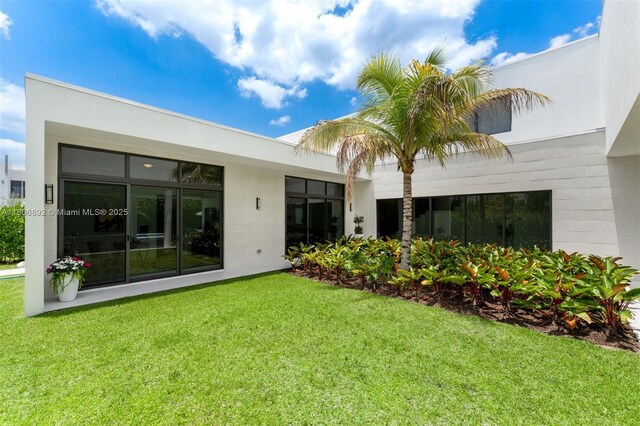 16703 S Botaniko Dr S, Weston, FL 33326 - back of house with a yard and concrete block siding