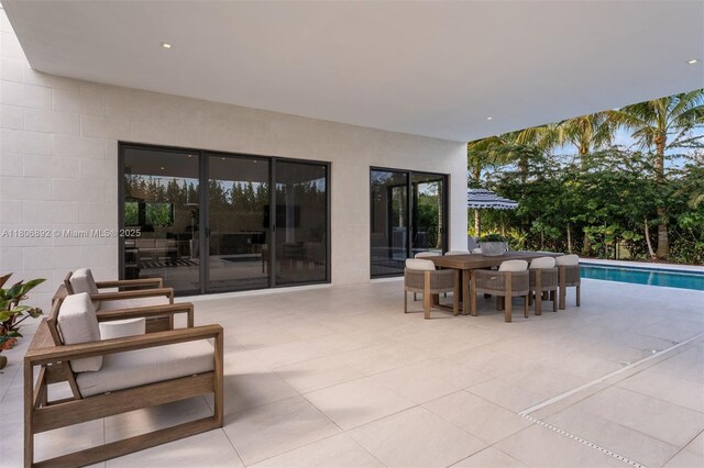 16703 S Botaniko Dr S, Weston, FL 33326 - view of patio featuring an outdoor pool and outdoor dining area