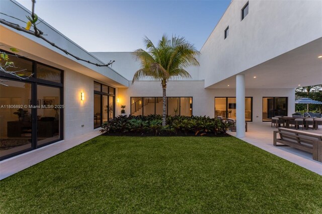 16703 S Botaniko Dr S, Weston, FL 33326 - view of green lawn featuring a patio
