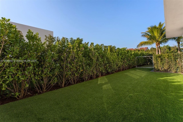 16703 S Botaniko Dr S, Weston, FL 33326 - view of grassy yard with a carport