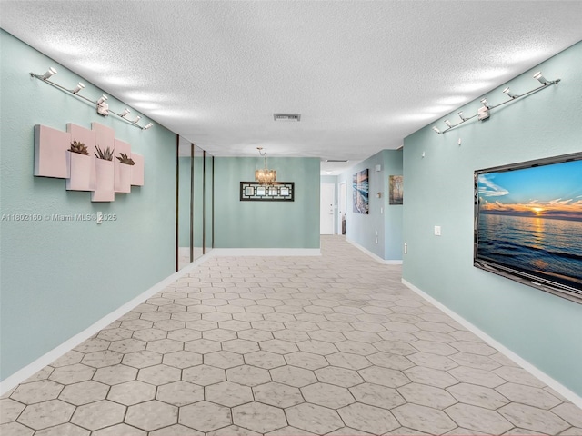 13785 Flora Pl Unit A, Delray Beach, FL 33484 - unfurnished room with a textured ceiling