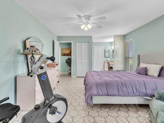 13785 Flora Pl Unit A, Delray Beach, FL 33484 - bedroom featuring a textured ceiling and a ceiling fan