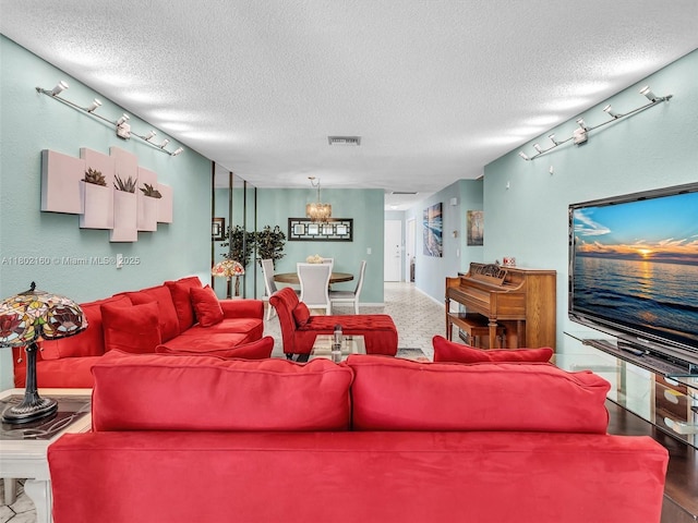 13785 Flora Pl Unit A, Delray Beach, FL 33484 - living room featuring a textured ceiling