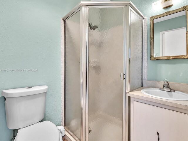 13785 Flora Pl Unit A, Delray Beach, FL 33484 - full bath featuring vanity, a shower stall, and a textured wall
