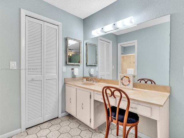 13785 Flora Pl Unit A, Delray Beach, FL 33484 - bathroom featuring a closet and vanity