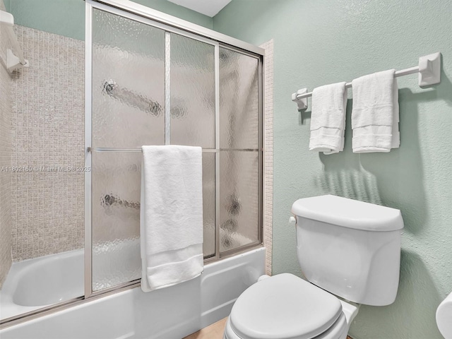 13785 Flora Pl Unit A, Delray Beach, FL 33484 - bathroom with bath / shower combo with glass door and a textured wall