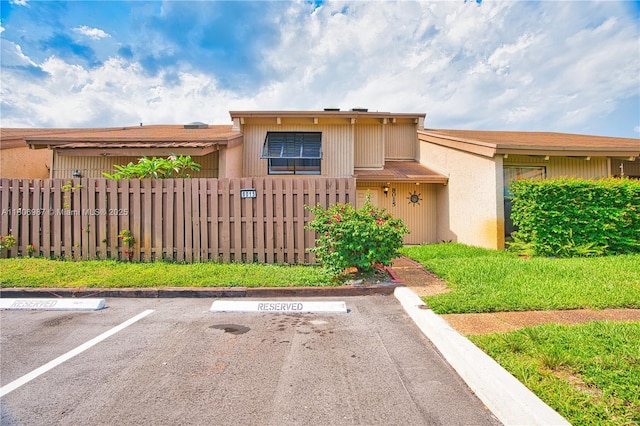 8015 SW 21st Ct, Davie, FL 33324 - view of property with uncovered parking and a fenced front yard