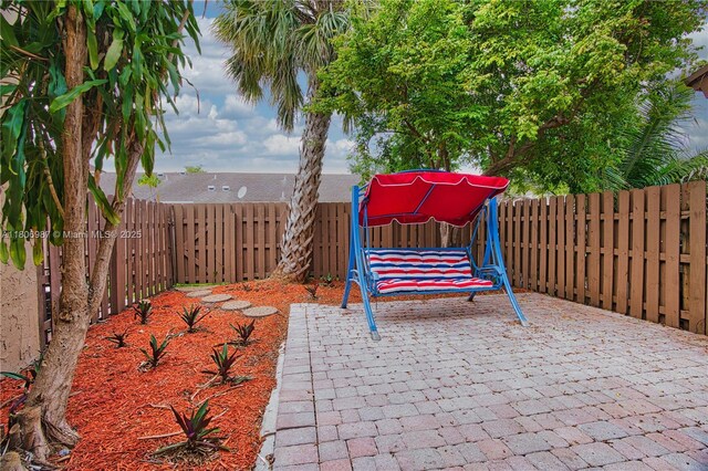 8015 SW 21st Ct, Davie, FL 33324 - fenced backyard with a patio area