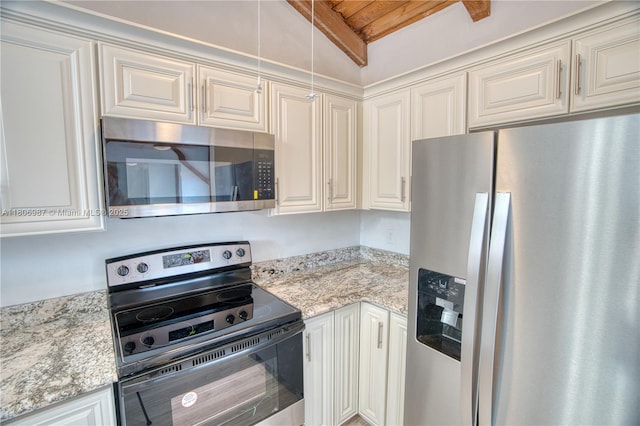 8015 SW 21st Ct, Davie, FL 33324 - kitchen with stainless steel appliances, vaulted ceiling, light stone countertops, wood ceiling, and white cabinets