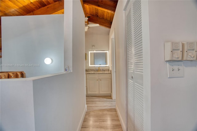 8015 SW 21st Ct, Davie, FL 33324 - hall featuring wood ceiling, light wood-type flooring, baseboards, and a sink