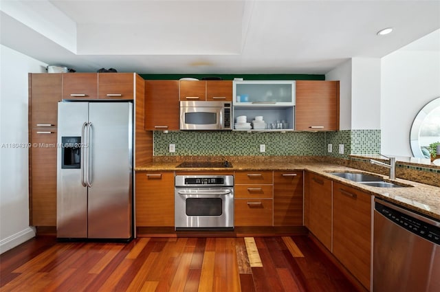 3330 NE 190th St Unit 717, Aventura, FL 33180 - kitchen with appliances with stainless steel finishes, dark wood-style flooring, brown cabinets, and recessed lighting