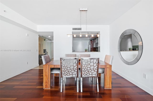 3330 NE 190th St Unit 717, Aventura, FL 33180 - dining area featuring wood finished floors and baseboards