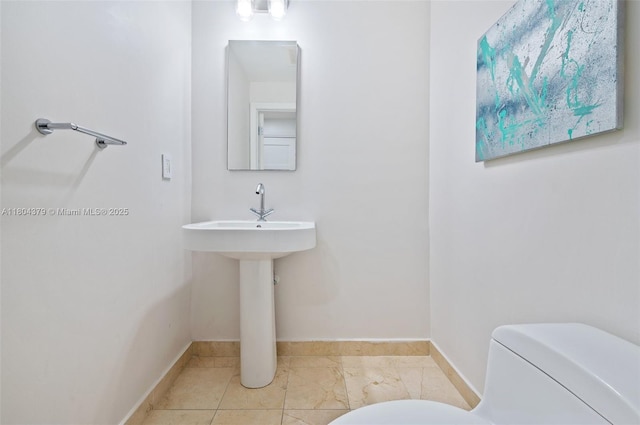 3330 NE 190th St Unit 717, Aventura, FL 33180 - bathroom featuring toilet and baseboards
