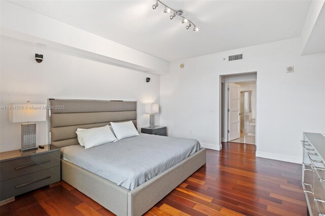 3330 NE 190th St Unit 717, Aventura, FL 33180 - bedroom with wood finished floors, baseboards, and track lighting