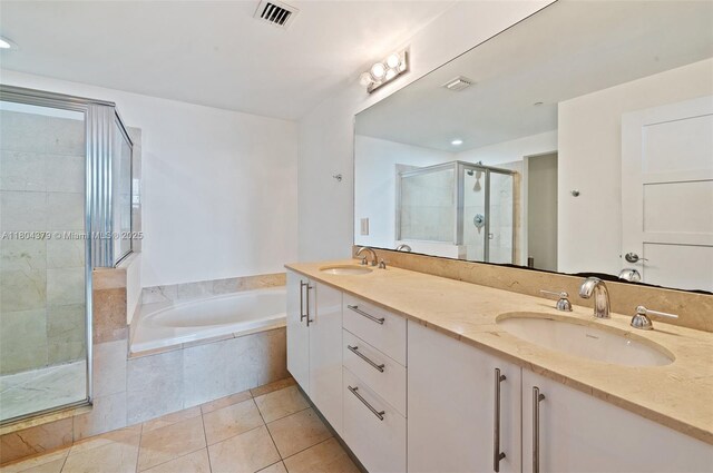 3330 NE 190th St Unit 717, Aventura, FL 33180 - bathroom featuring a shower stall, tile patterned flooring, a bath, and double vanity