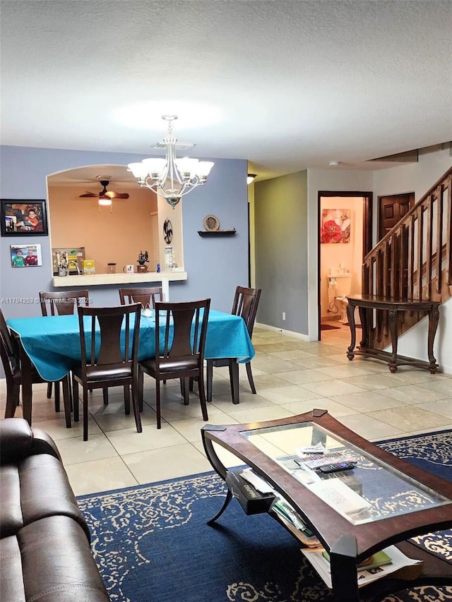 8014 Big Pine Way, Riviera Beach, FL 33407 - living area with a chandelier, stairs, ceiling fan, light tile patterned flooring, and a textured ceiling