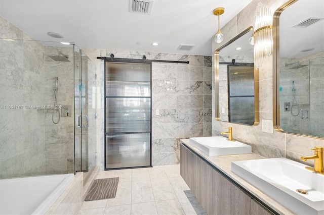 801 S Miami Ave Unit 3510, Miami, FL 33130 - full bathroom featuring tile walls, a stall shower, double vanity, recessed lighting, and a tub