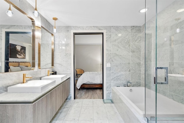 801 S Miami Ave Unit 3510, Miami, FL 33130 - full bath with ensuite bath, tile walls, a garden tub, a shower stall, and double vanity