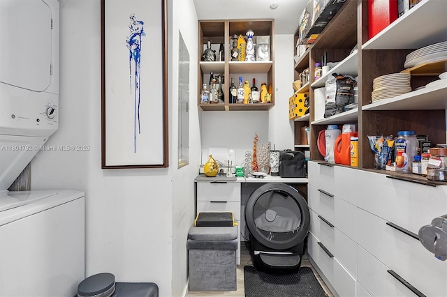 801 S Miami Ave Unit 3510, Miami, FL 33130 - washroom featuring estacked washer and dryer and wood finished floors