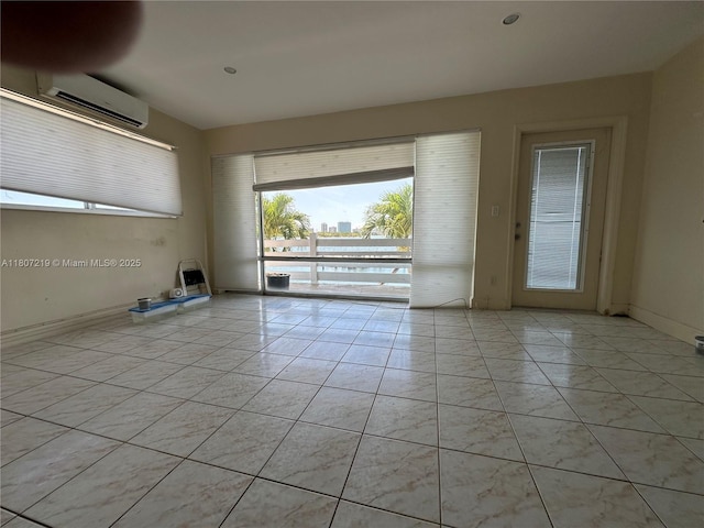 2700 NE 135th St Unit 56, North Miami, FL 33181 - spare room featuring plenty of natural light and a wall unit AC