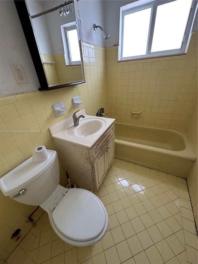 2700 NE 135th St Unit 56, North Miami, FL 33181 - bathroom featuring tile patterned floors, tile walls, plenty of natural light, shower / bath combination, and toilet