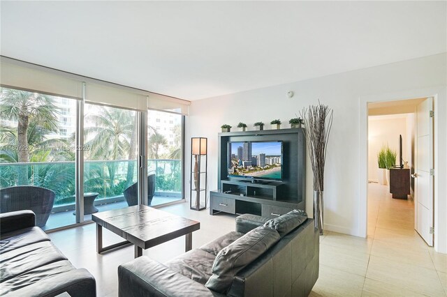 4001 S Ocean Dr Unit 3P, Hollywood, FL 33019 - living area featuring floor to ceiling windows and light tile patterned floors