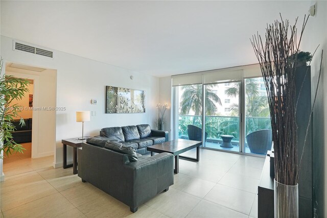 4001 S Ocean Dr Unit 3P, Hollywood, FL 33019 - living room featuring light tile patterned flooring and expansive windows